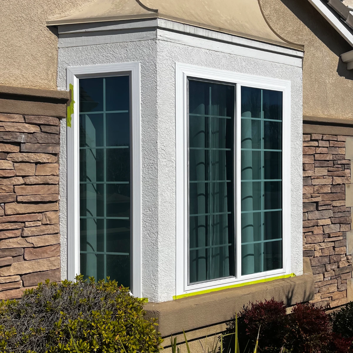 Bay window with grid design and white framing