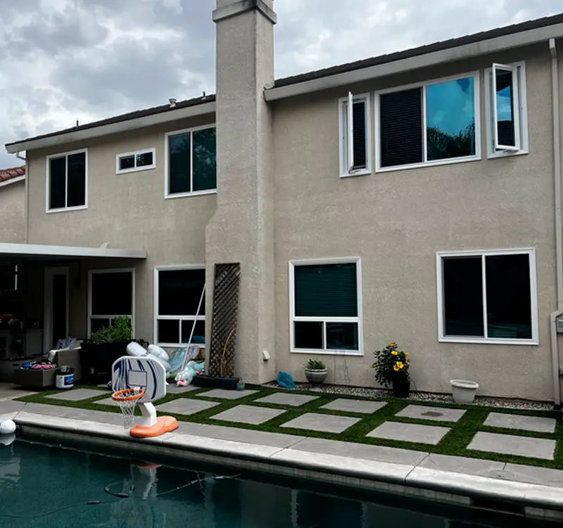 Rear view of Sacramento home with new double-hung and sliding windows installed by Clear View
